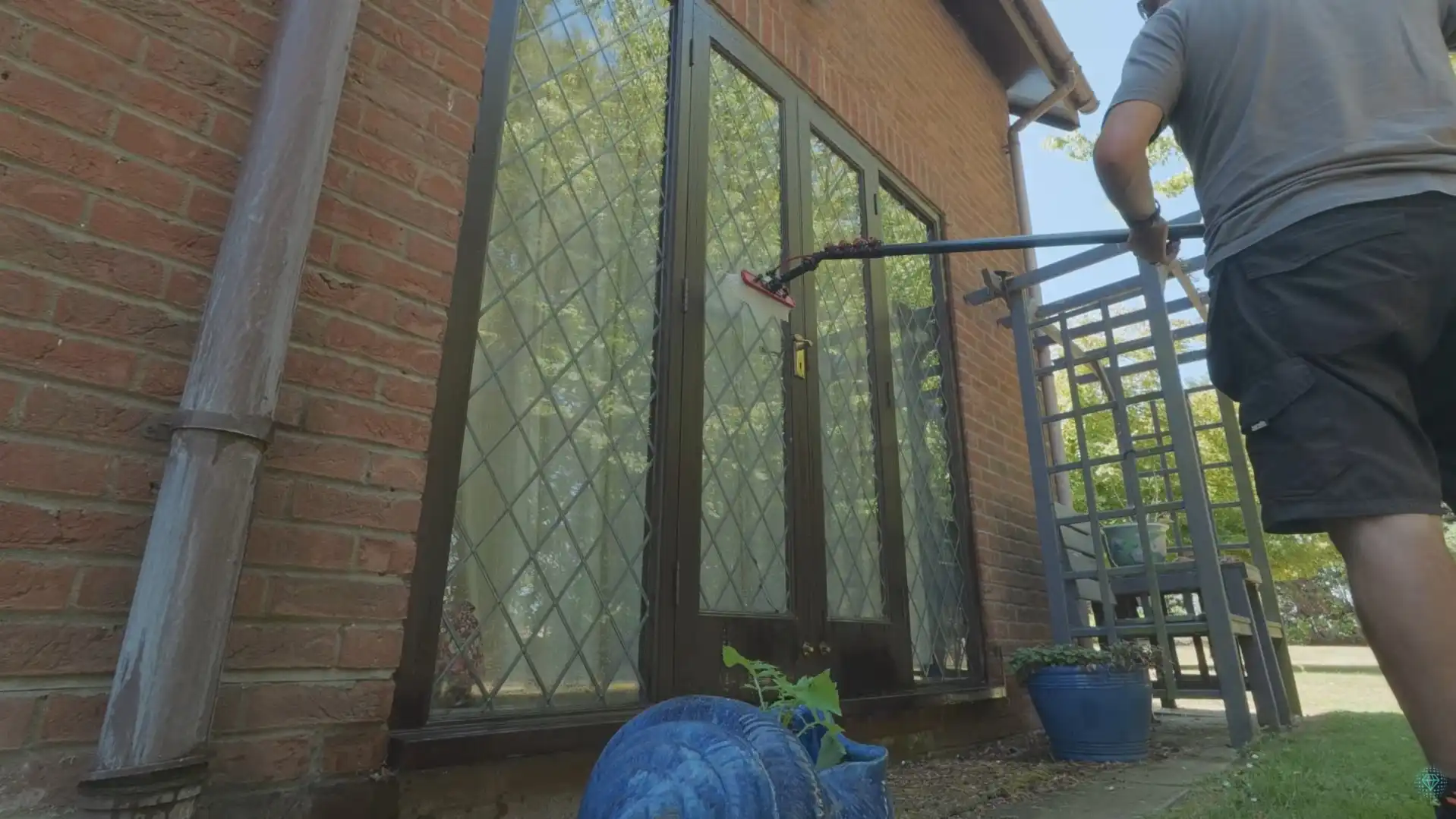 Window cleaner washing residential glass doors